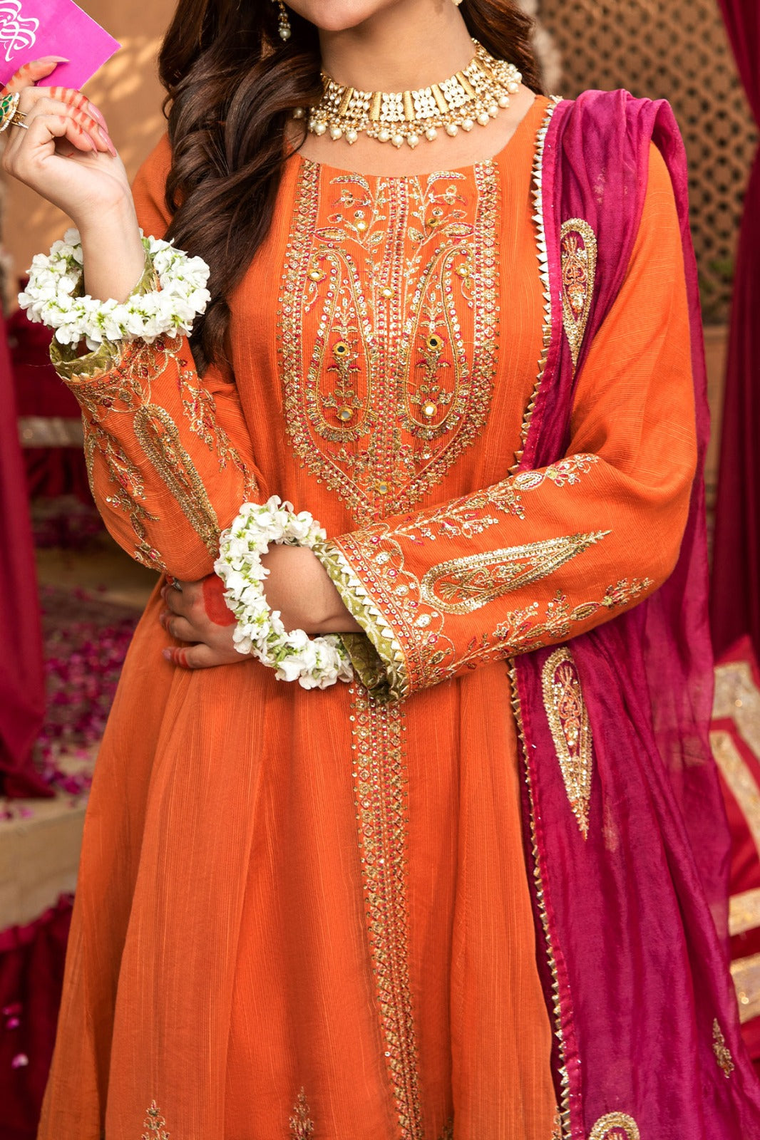 Orange frock with embroidery and mirror work neckline and viscose trouser and silk organza dupatta