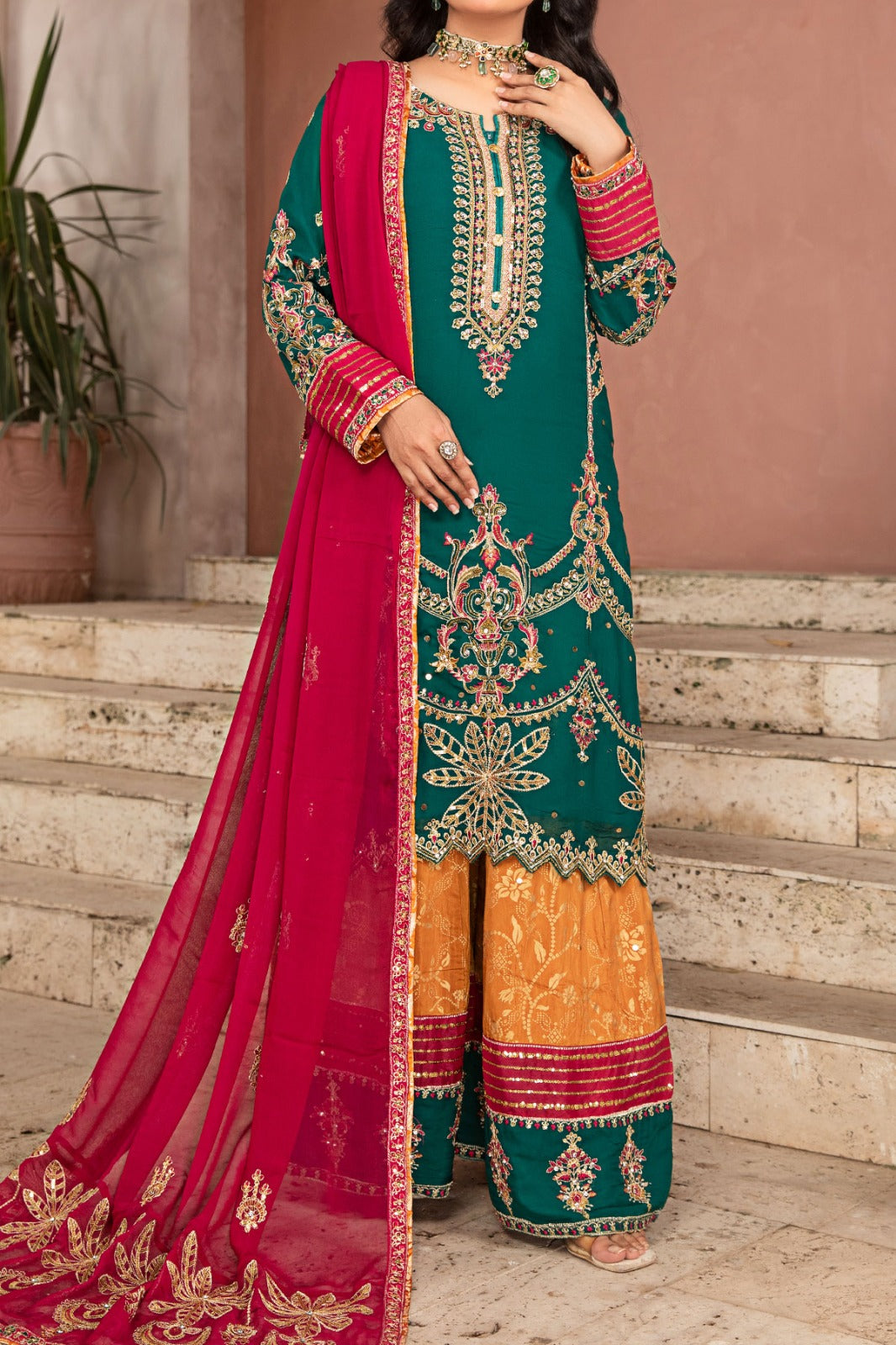 Green chiffon shirt with multi-coloured sharara, embroidered with screen printing and embellished with sequins, paired with chiffon embroidered dupatta and viscose sharara